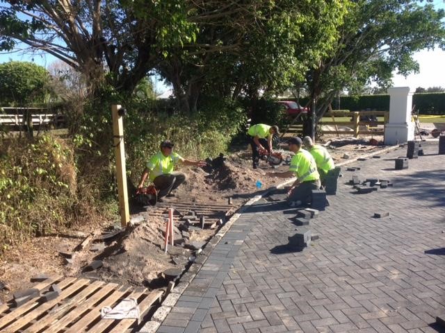 The crew working hard installing the eco-flex tile.