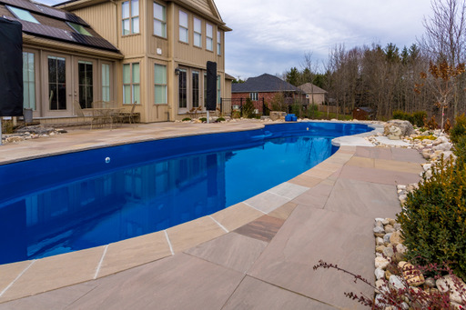 Installed pool and patio with coping