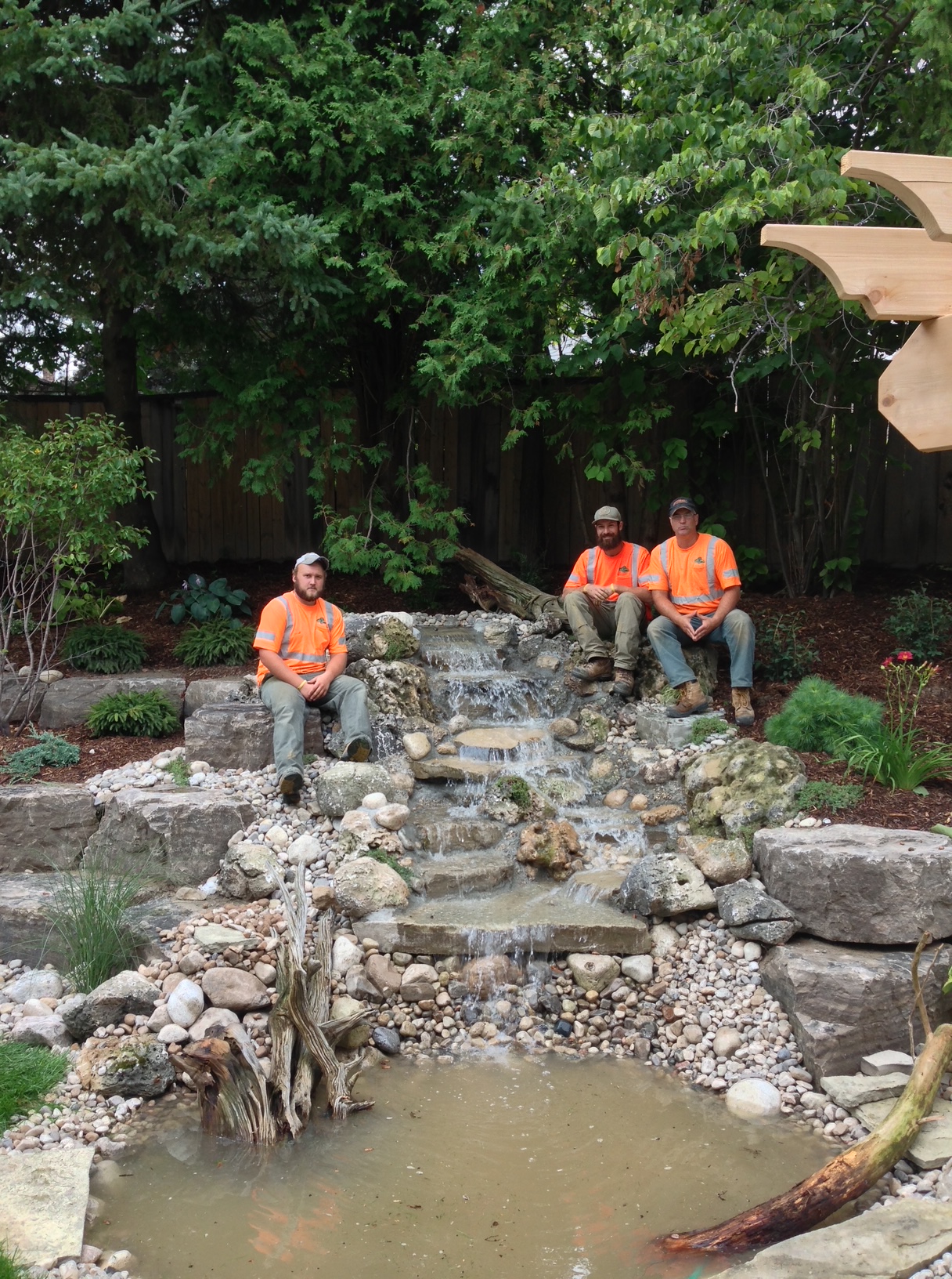 The crew on top of waterfall installed in Oakville
